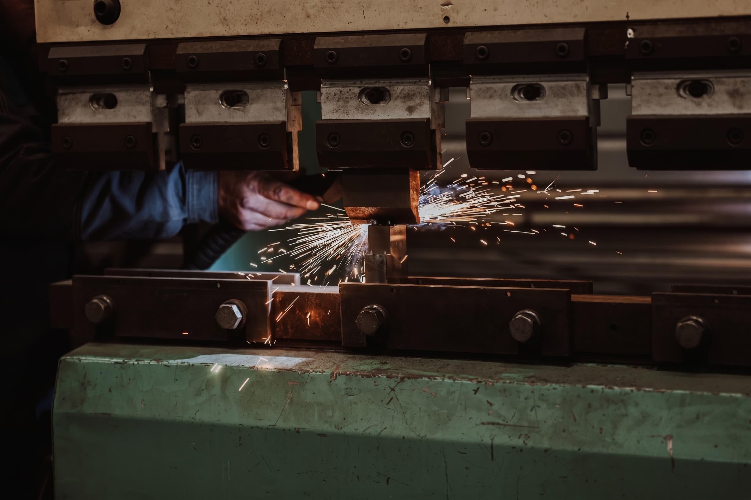 Press brake forming a sheet metal panel